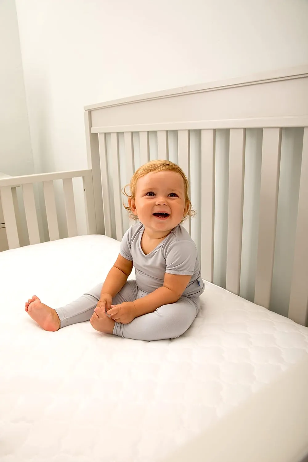 Sealy Baby Antimicrobial Fitted Waterproof Infant Crib Mattress Protector Pad and Toddler Bed Cover, Designed to Neutralize Odors, Machine Washable and Dryer Friendly, 52” x 28”- White