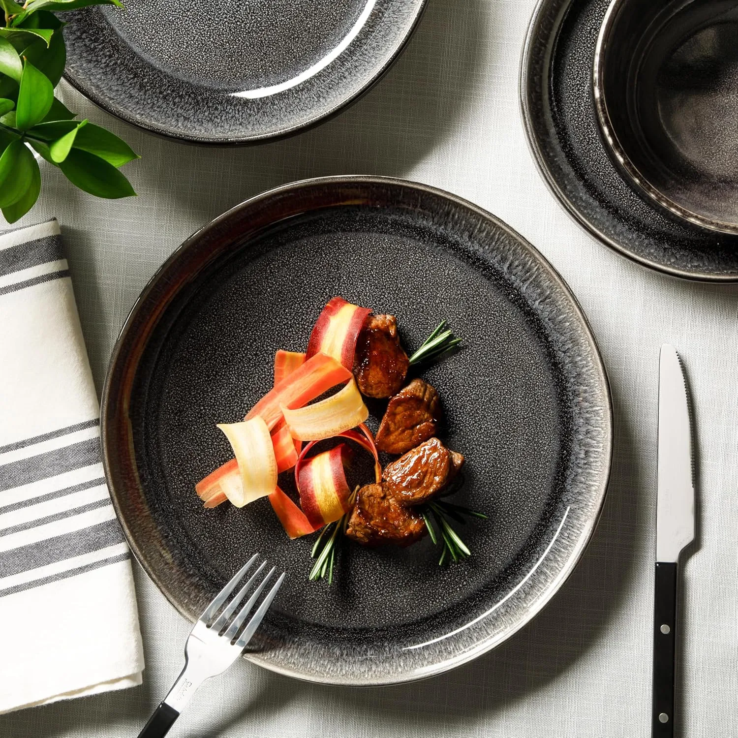 Sur La Table Kitchen Essentials Banquette 16 Piece Double Bowl Plates and Bowls Reactive Glaze Stoneware Dinnerware Set - Black