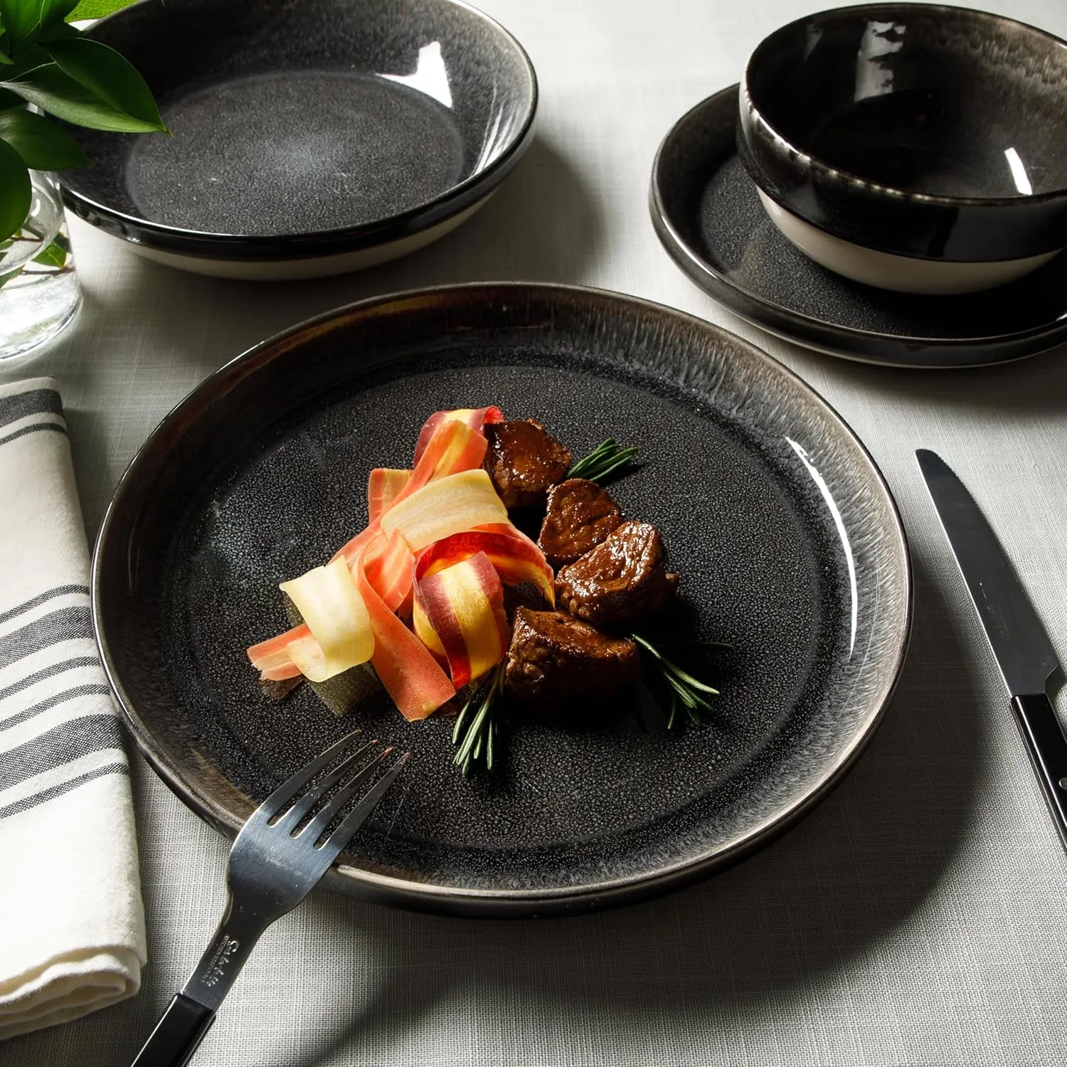 Sur La Table Kitchen Essentials Banquette 16 Piece Double Bowl Plates and Bowls Reactive Glaze Stoneware Dinnerware Set - Black