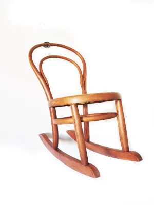Vintage child’s bentwood rocker chair with woven wicker seat