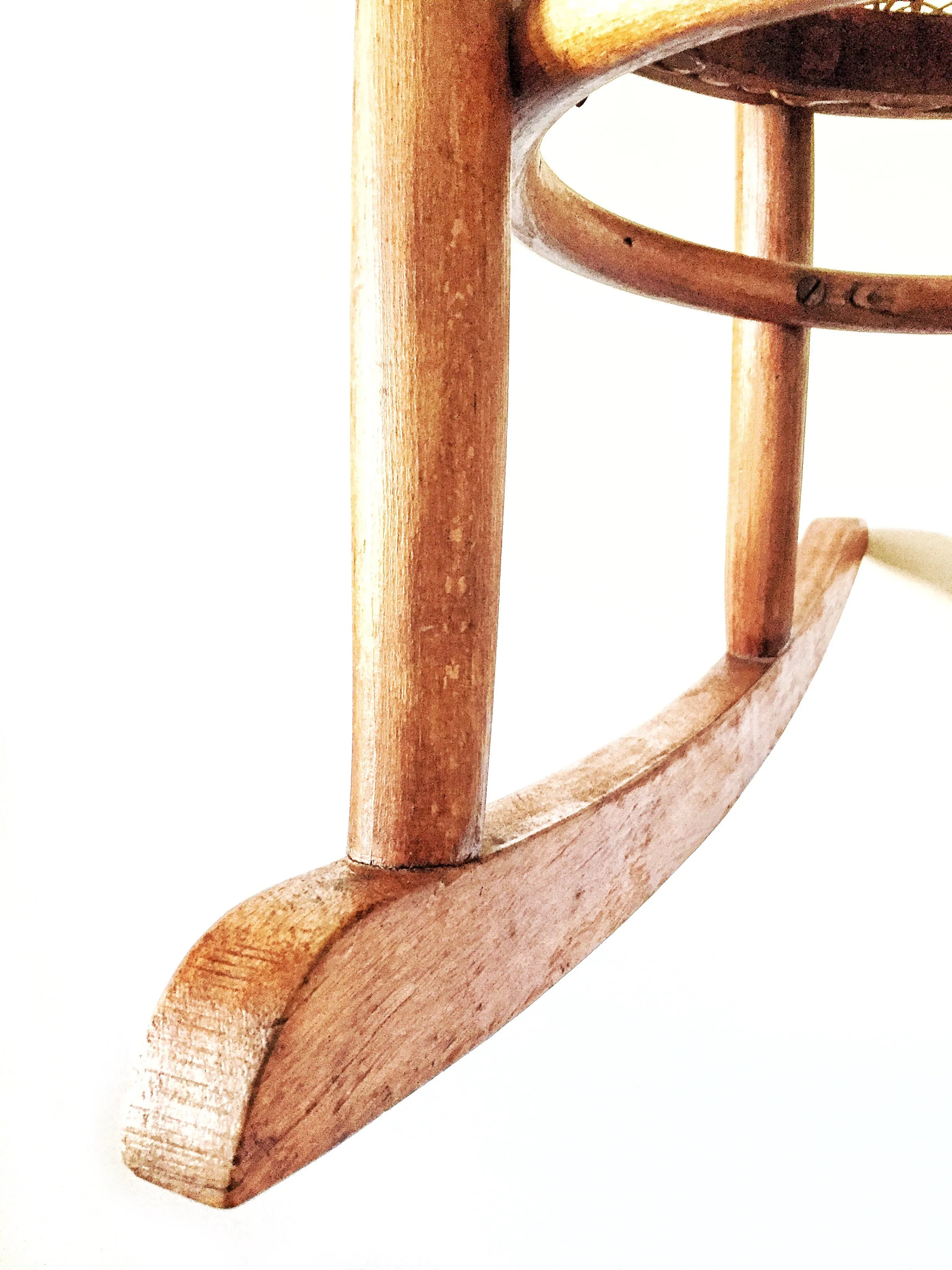 Vintage child’s bentwood rocker chair with woven wicker seat