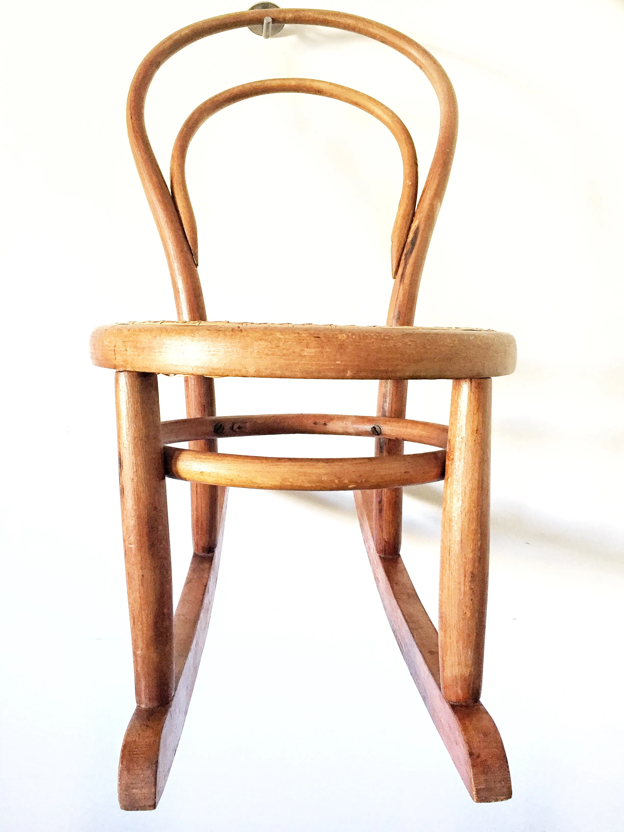 Vintage child’s bentwood rocker chair with woven wicker seat